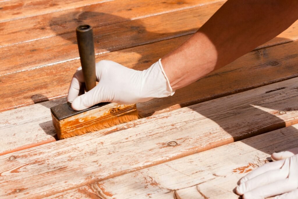 About Us 4 Deck maintenance apply stain on wooden decking